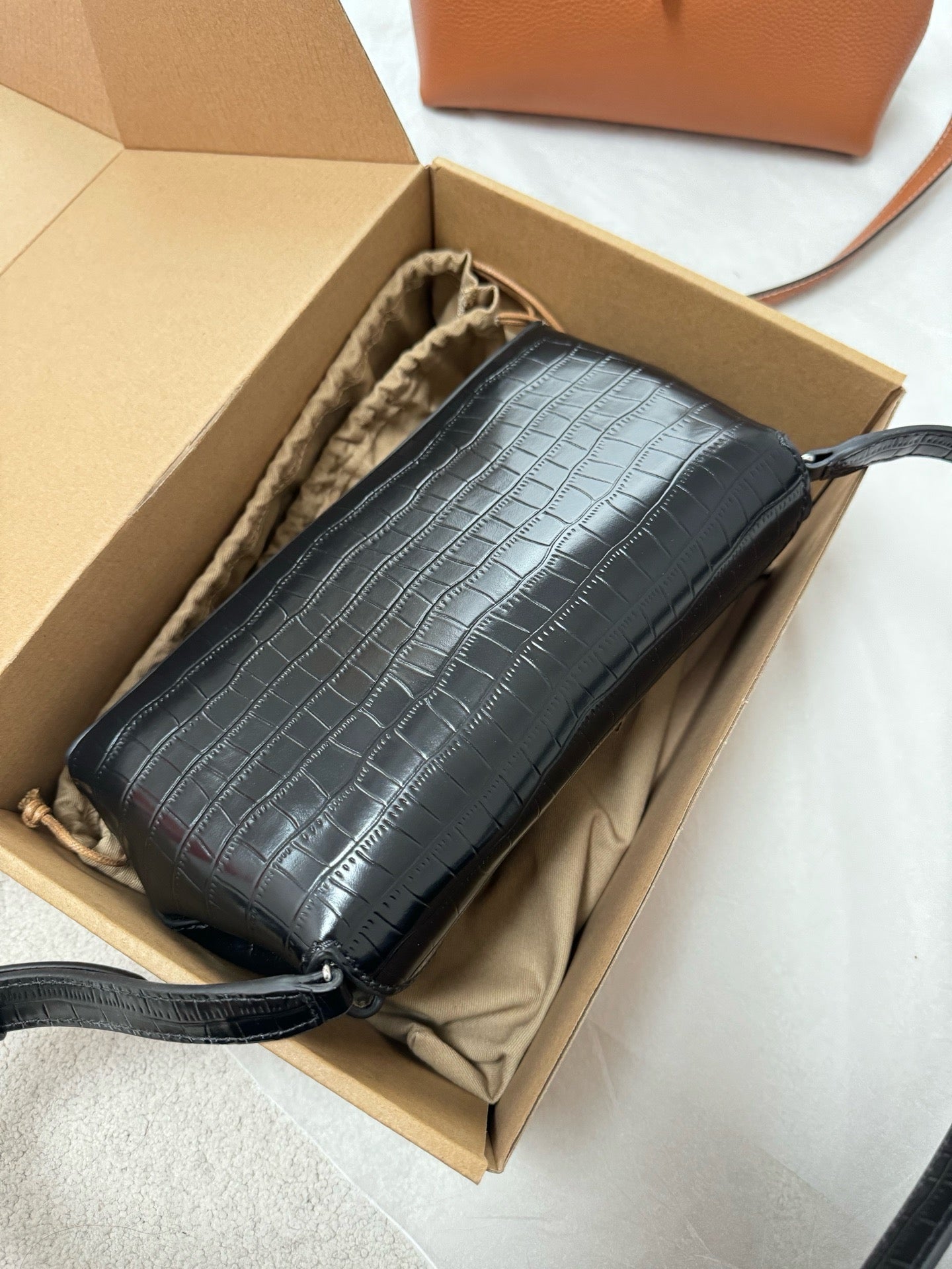 Tot T-Lock crocodile-effect leather clutch bag