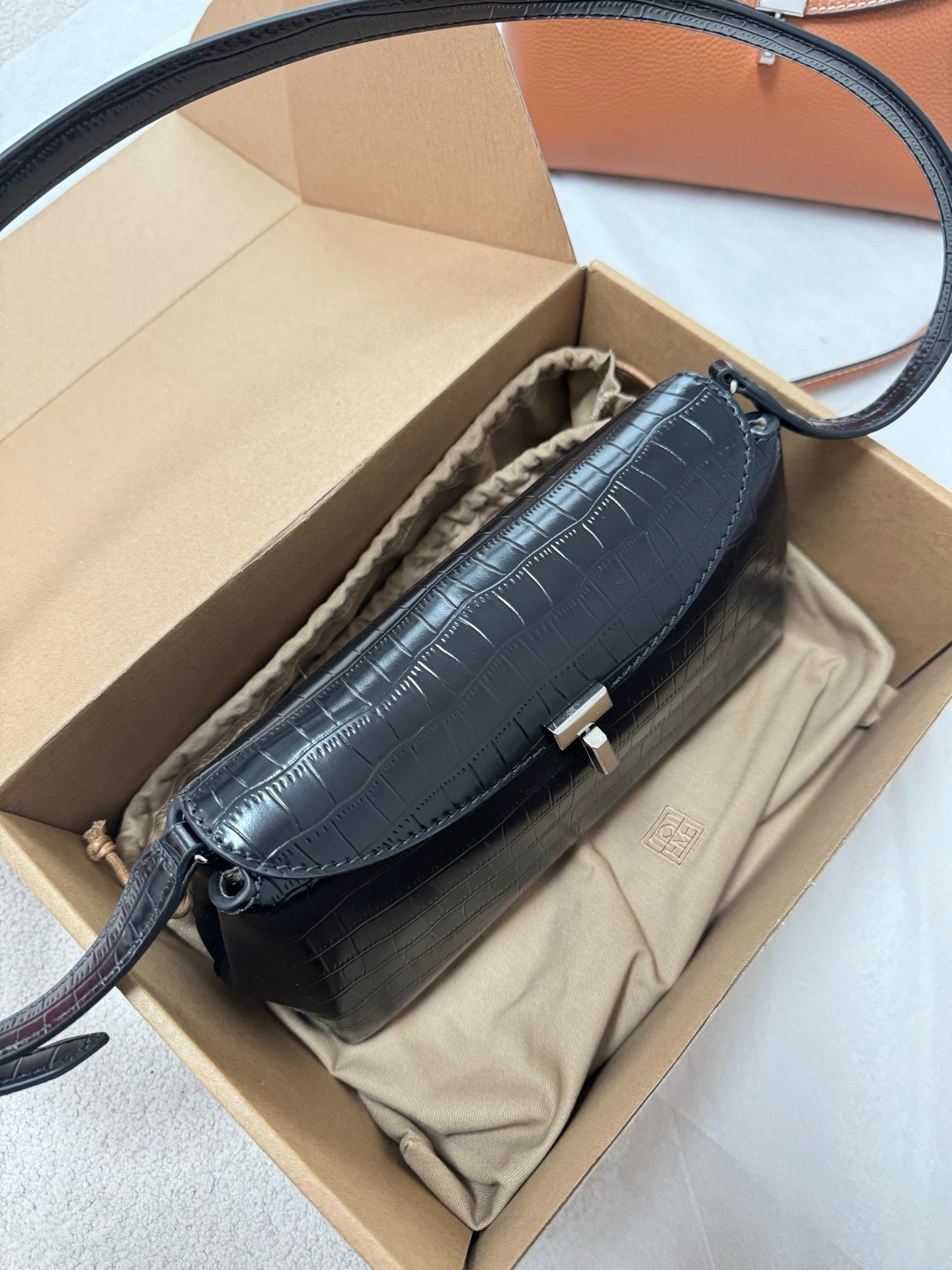 Tot T-Lock crocodile-effect leather clutch bag